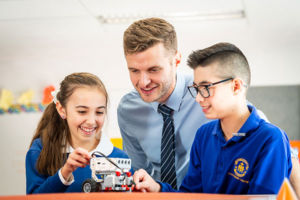 Teacher and students working with robotics at St Catherine Labouré Catholic Primary School Gymea