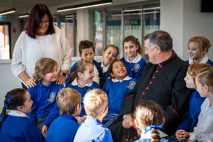 Parosh Priest and Principal of St Catherine Laboure Catholic Primary School Gymea chatting with students